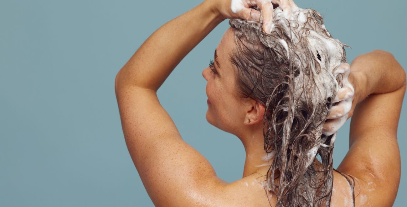 The hair-washing frequency question — what actually happens when you wash less